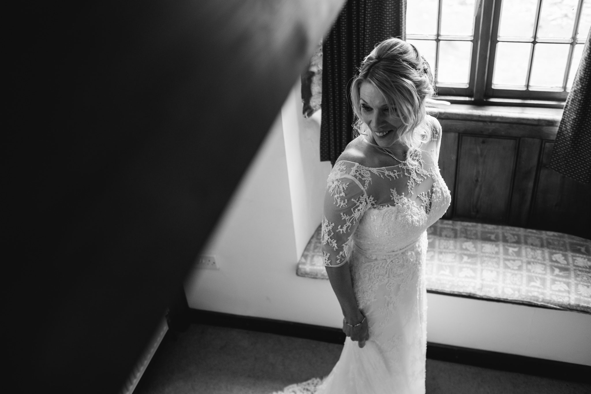 Classic black and white bride portrait at a countryside cottage in The Lake District